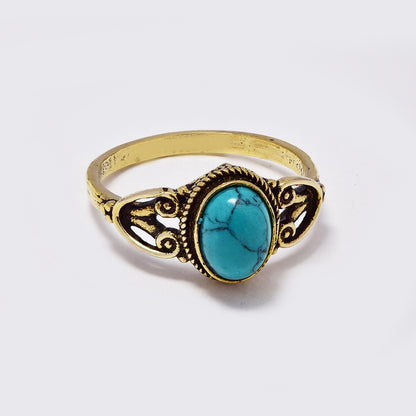 Brass ring with long oval gemstone with rope and filigree frame - IFR704