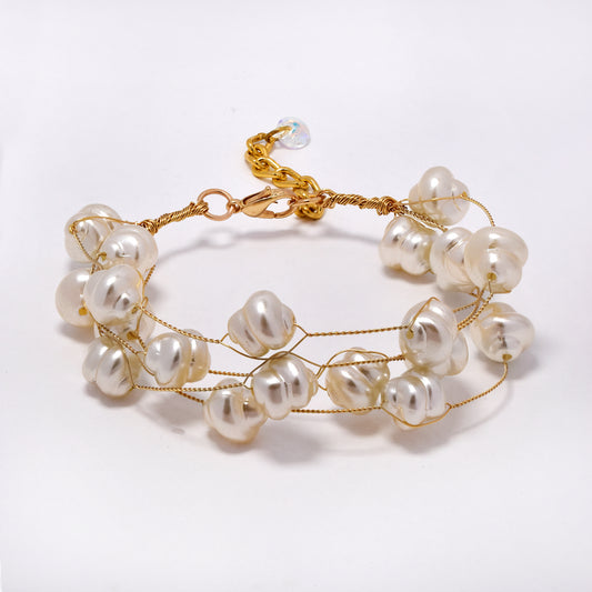 Intertwined multi strand swirl shaped faux pearl bracelet - YB5294